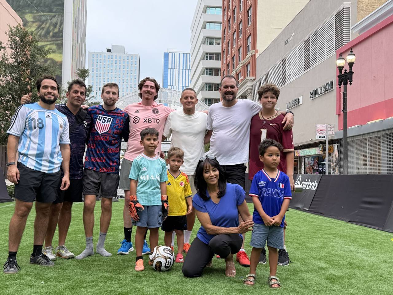 Players and families gather on the pitch after the session